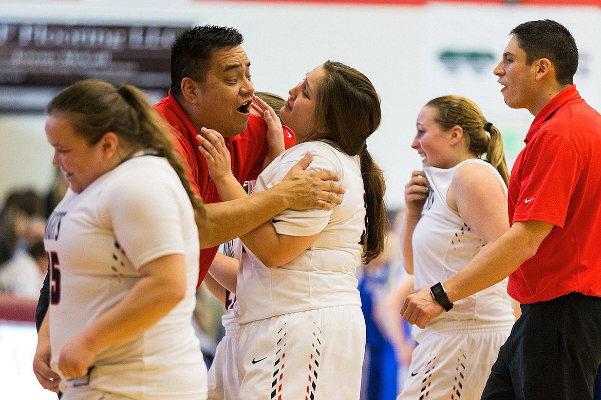 &lt;p&gt;SHAWN GUST/Press Lakeside High&#146;s Corin Peone is emotional while celebrating with assistant coach Jess Arthur after hitting a three-pointer at the buzzer to tie the game in regulation Thursday at the state 1A Division II girls basketball tournament at Nampa High School. Lakeside was defeated by Rockland High in overtime 66-62.&lt;/p&gt;