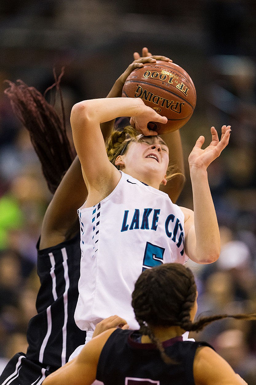 &lt;p&gt;SHAWN GUST/Press Lake City High School&#146;s Bridget Rieken has her shot blocked by a Centennial defender during the second quarter of the state 5A girls basketball tournament.&lt;/p&gt;