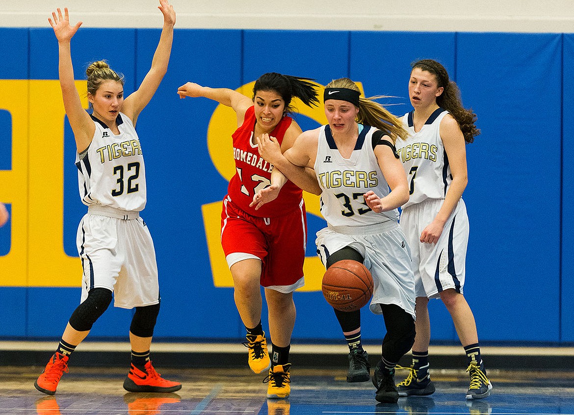 &lt;p&gt;SHAWN GUST/Press Timberlake&#146;s Keelie Lawler (33) gets tangled with Homedale&#146;s Elizabeth Vargas while racing for a loose ball during the fourth quarter.&lt;/p&gt;