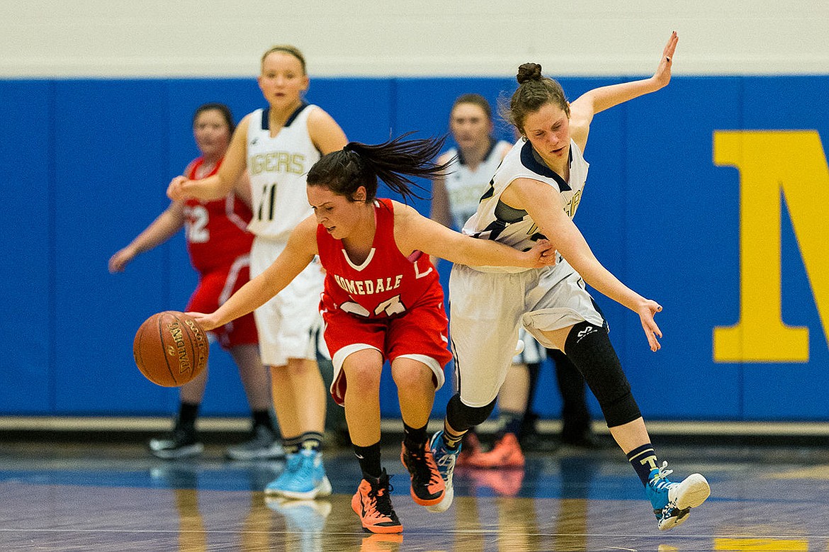 &lt;p&gt;SHAWN GUST/Press Timberlake High&#146;s Allison Kirby attempts to steal the ball from Homedale&#146;s Makayla Aberasturi during the third quarter in Middleton.&lt;/p&gt;