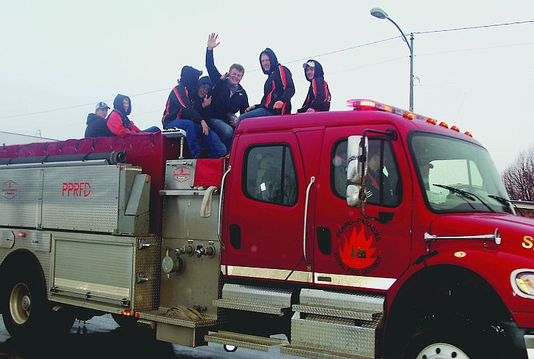 &lt;p&gt;The Plains wrestlers hopped on a fire truck Thursday morning before heading to the State Tournament for a town-wide send off. With sirens blaring, the boys made their way down the main strip of Plains and to the awaiting bus that took them to Billings.&lt;/p&gt;