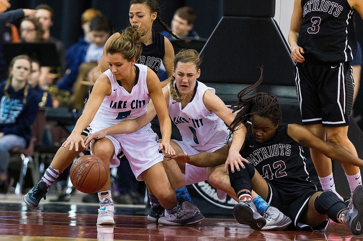 &lt;p&gt;SHAWN GUST/Press&lt;/p&gt;&lt;p&gt;Lake City&#146;s Cierra Dvorak, far left, gets the best position on a scramble for the ball as teammate Bridget Rieken (5) and Centennial's Dominique Williams fall to the floor during the second quarter.&lt;/p&gt;