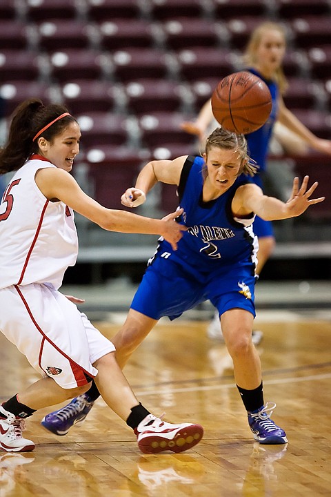 &lt;p&gt;Coeur d'Alene High's Heather Baughman (2) knocks the ball loose from a Boise's Aleah Lowber Thursday during the first round of girls state 5A basketball at the Idaho Center in Nampa.&lt;/p&gt;