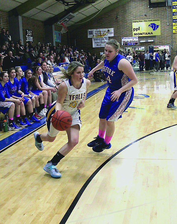 &lt;p&gt;Madison Fitchett takes the ball into the paint during the girl's game against Bigfork.&lt;/p&gt;