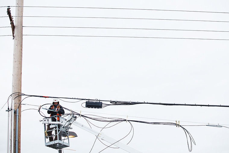 &lt;p&gt;Chris Galloway of Montana Digital hangs fibre optic cables Tuesday afternoon near west Reserve Drive and Whitefish Stage Road. Seven miles of cable is being hung from The Glacier building in Kalispell to the Flathead Electric Cooperative substation on Whitefish Stage Road. Tuesday, Feb. 12, 2013 in Kalispell, Montana. (Patrick Cote/Daily Inter Lake)&lt;/p&gt;