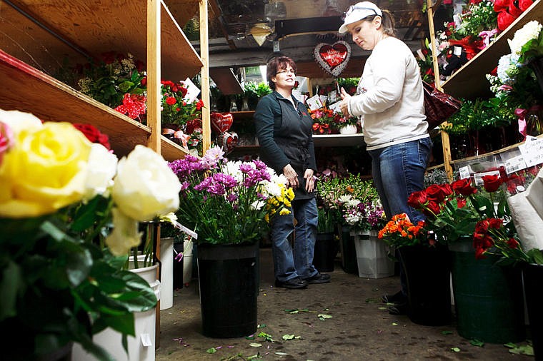 &lt;p&gt;Kimarie Wolf, left, helps Joda Taylor select flowers Wednesday afternoon at Woodland Floral in Kalispell. Taylor is traveling to Arizona to visit her son on Valentine's day and was putting together a bouquet of flowers for her son's fianc&eacute;e. Wednesday, Feb. 13, 2013 in Kalispell, Montana. (Patrick Cote/Daily Inter Lake)&lt;/p&gt;