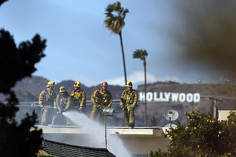 &lt;p&gt;Firefighters battle a blaze at a house where authorities say at least three people were shot and wounded Thursday in east Los Angeles. A 34-year-old man and two 38-year-old women had been shot and police took them from the front of the home, authorities said.&lt;/p&gt;