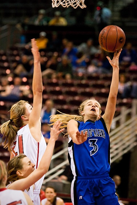 Amanda Buttrey, of Coeur d'Alene, puts up a lay-in against a Boise High defender.