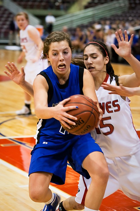 The Vikings' Kyeli Parker drives passed Aleah Lowber, of Boise High, during the first half in Nampa.