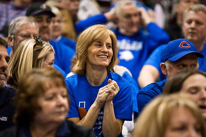 Sue Plamer, whose daughter, Amy, plays for Coeur d'Alene, cheers for girls team Thursday in Nampa.