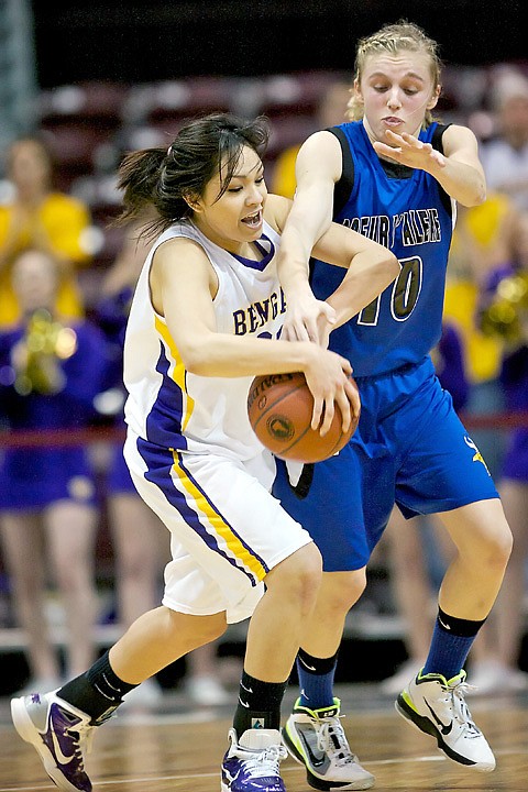 <p>Coeur d'Alene High's Caelyn Orlandi tries to knock the ball away from Tisha Phillips from Lewiston High during the second half.</p>