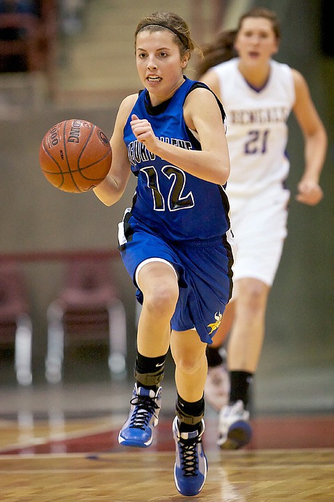 <p>Coeur d'Alene High's Kyeli Parker races down the court on a breakaway during the first half of the 5A state basketball championship game Friday at the Idaho Center in Nampa.</p>