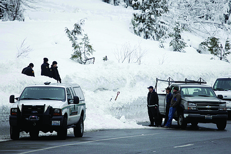 &lt;p&gt;King County Sheriff's officers and other emergency officials work along Highway 2 near Stevens Pass ski resort in Skykomish, Wash., near where three skiers were killed in an avalanche Sunday.&lt;/p&gt;