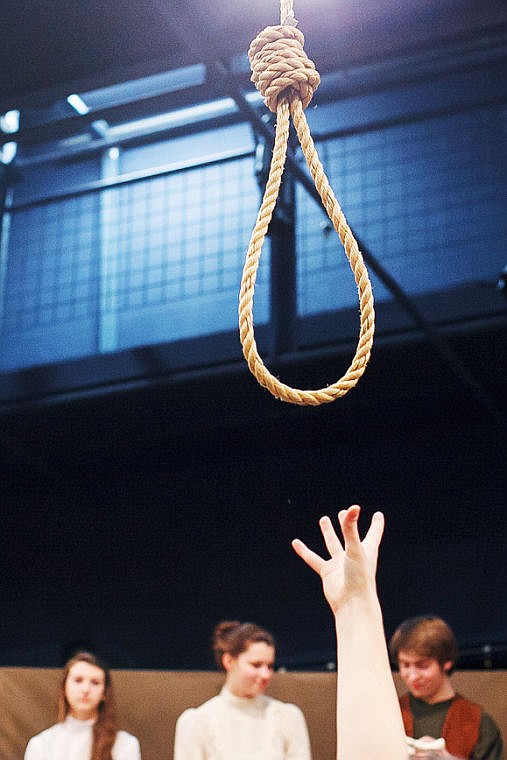 <p>A noose is lowered into place before a dress rehearsal for "The Crucible" at Flathead High School Feb. 19.</p>