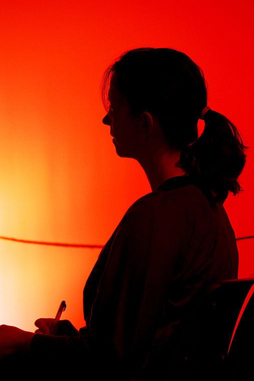 <p>Wendy Putzler takes notes during a dress rehearsal for "The Crucible" at Flathead High School Feb. 19.</p>