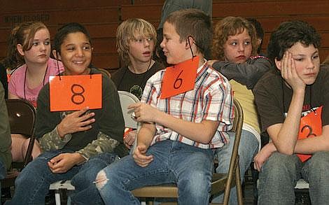 Photos by Aaric Bryan&lt;br&gt;St. Regis seventh-graders Isaiah Withey (left) and Shad Rich find a way to keep themselves amused after bowing out of the St. Regis Spelling Bee, while Dallas Yearout looks dejected.