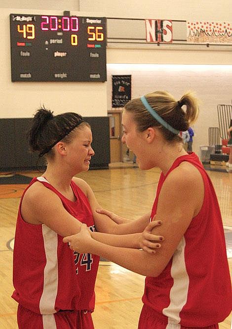 Photo by Aaric Bryan&lt;br&gt;Bobcat Koltan Plouffe is moved to tears as she celebrates Superior's 56-49 victory over St. Regis with Shannon Frederick at the Ronan Event Center. The Saturday victory ended a nearly three-year winless drought for the Lady Bobcats.