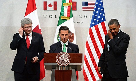 &lt;p&gt;Canada's Prime Minister Stephen Harper, left, and President Barack Obama, right, look on as Mexico's President Enrique Pena Nieto speaks at a news conference during the North American Leaders Summit in Toluca, Mexico, Wednesday.&lt;/p&gt;