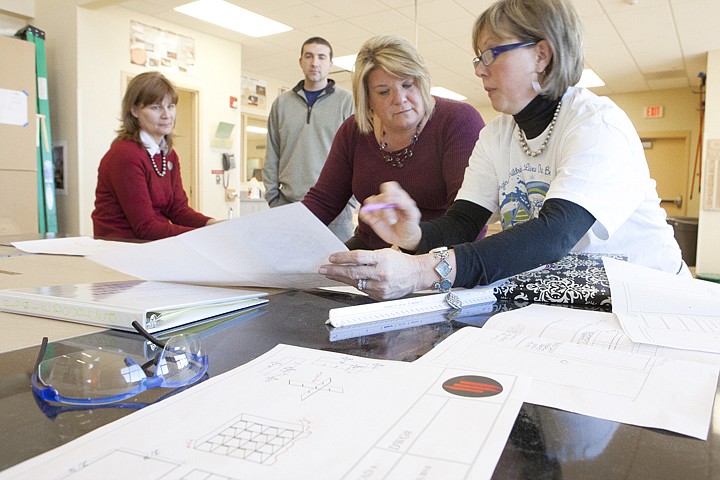 &lt;p&gt;Glacier teachers Joan Herzog, Andy Fors and Lori Gray, from
left, meet with Special Spaces director Paula Strickland in the
Industrial Arts pod at Glacier High School Tuesday afternoon to
discuss the plans for the make over of Caleb Speed's bedroom.&lt;/p&gt;