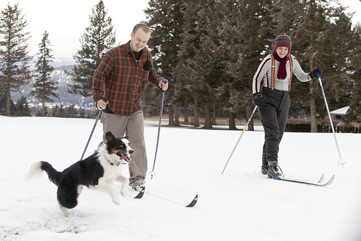 &lt;p&gt;Takoda, a border collie and Australian shepherd mix, chases
along as Kait Gelinas, right, and Trevor Mack cross-country ski on
the fairway of Hole 2 at Buffalo Hill Golf Course Friday
afternoon.&lt;/p&gt;