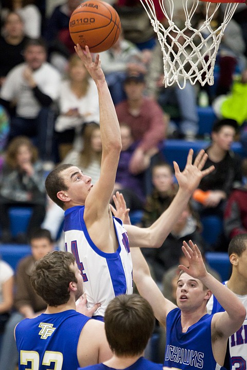 &lt;p&gt;Bigfork's Jackson Boese (center) puts up a shot in the fourth
quarter of Bigfork's victory over Thompson Falls in the Class 7B
District Tournament at Bigfork High School Thursday night.&lt;/p&gt;