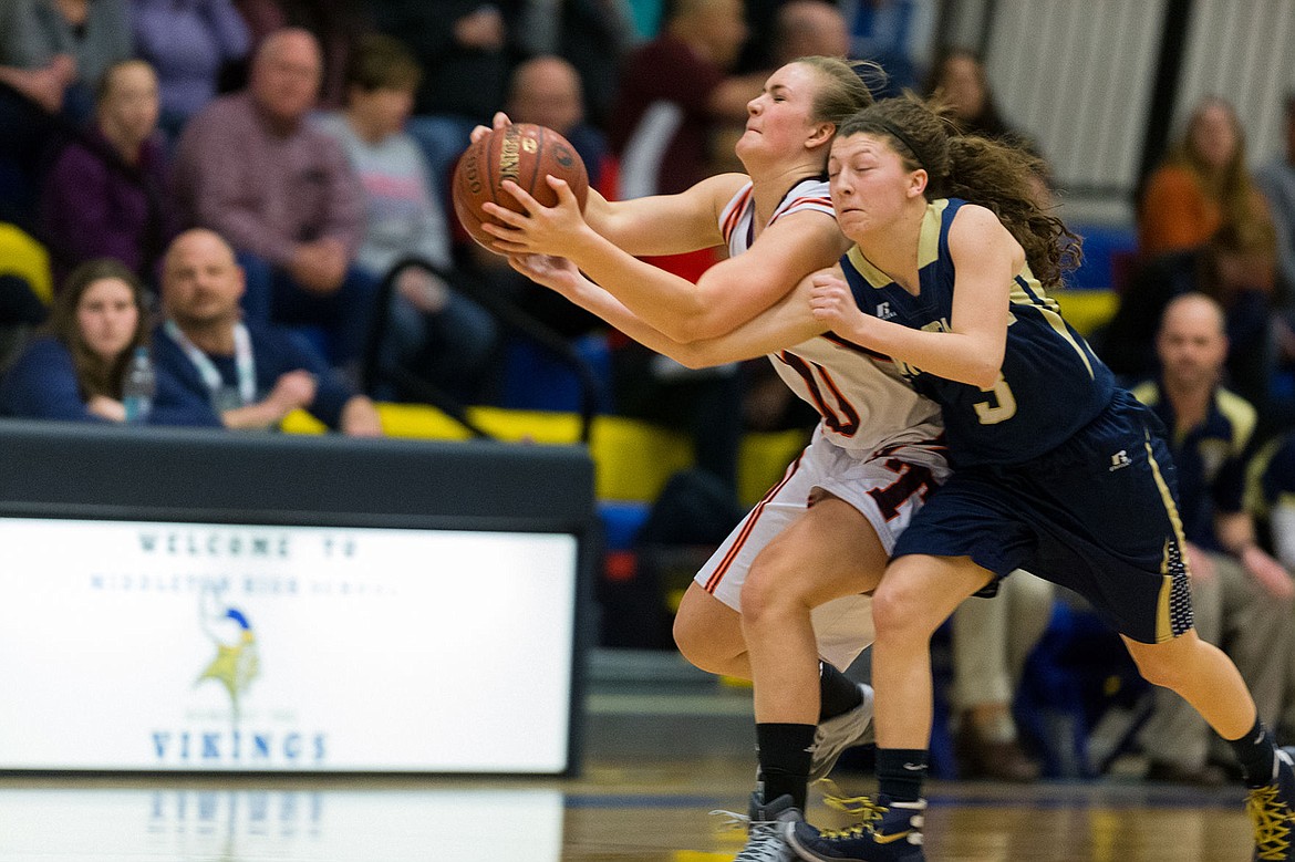 &lt;p&gt;SHAWN GUST/Press Timberlake High School&#146;s Lilly Kelley breaks up a pass to Teton High&#146;s Jenna Abbott during the first quarter of the state 3A girls basketball tournament Friday at Middleton High School.&lt;/p&gt;