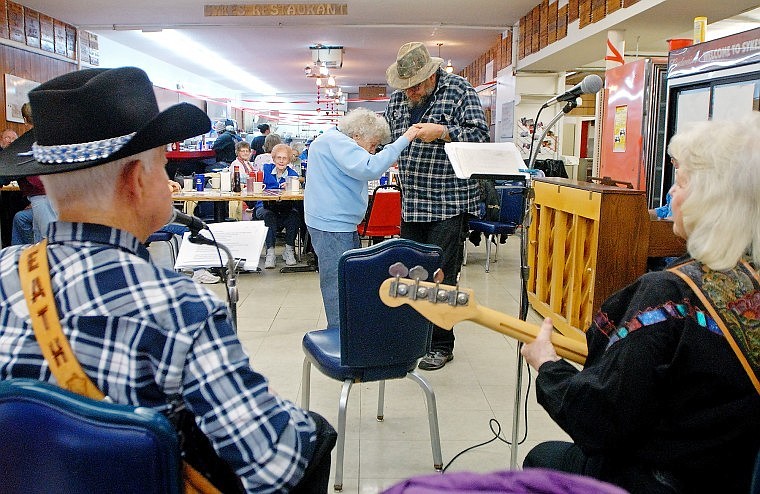 101-year-old Olive Greene dances with Monty McIlhargey while the group Country Classics performs at Sykes&#146; Restaurant on Wednesday afternoon. Live music is offered at Sykes&#146; from 1 to 3 p.m. every Wednesday.