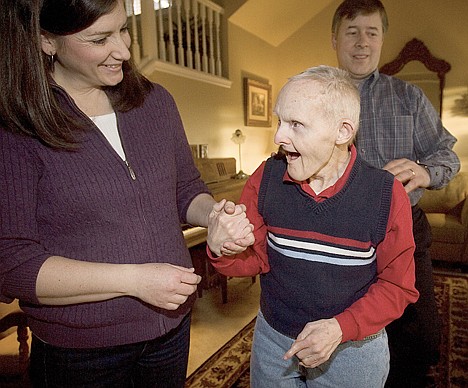 &lt;p&gt;This Jan. 30 picture shows, from left, Veanne Elg, Edgar Call and Van Elg in Boise, Idaho. The Elgs took in Edgar on the advice on Van's mother, who was working at a group home where Edgar was living.&lt;/p&gt;