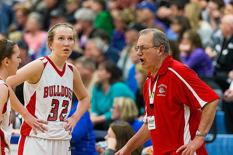 &lt;p&gt;Sandpoint High School head coach Duane Ward shares his opinion with the referees as his players approach during a time-out in the first half.&lt;/p&gt;