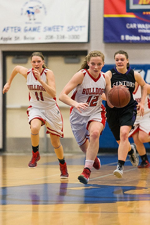 &lt;p&gt;Sandpoint High&#146;s Madi Schoening drives up the court after a turnover Friday against Century High School.&lt;/p&gt;