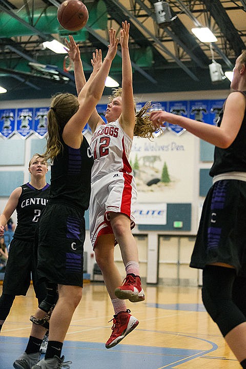 &lt;p&gt;Madi Schoening takes the ball to the hoop over a Century defender.&lt;/p&gt;