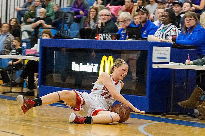 &lt;p&gt;Sandpoint High School&#146;s Elani Williams slides across the floor while trying to gain possession of a loose ball in the second quarter of the semi-final round of the state 4A girls basketball tournament against Century High School Friday in Boise.&lt;/p&gt;