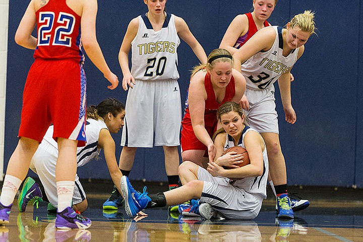 &lt;p&gt;Timberlake High School&#146;s Jacqelyn Matllet grimaces as she secures a loose ball against Filer High defenders during the second period of the state 3A girls basketball tournament Friday in Nampa.&lt;/p&gt;