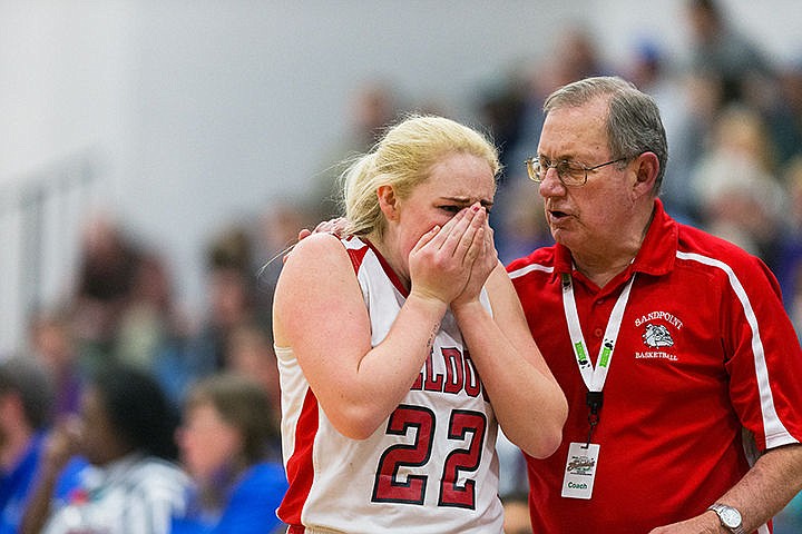 &lt;p&gt;Head coach Duane Ward comforts Lily Martin after she was hit in the face during the second half.&lt;/p&gt;