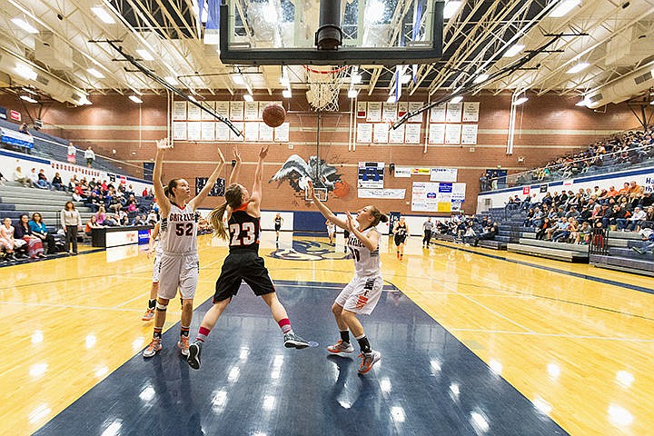 &lt;p&gt;Priest River&#146;s Elisa Williams (23) goes up for a shot between Fruitland defenders Brooke Teunissen (52) and Hailey Collins (30).&lt;/p&gt;