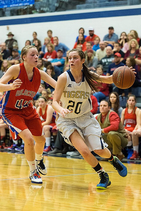 &lt;p&gt;Allison Kirby, a Timberlake guard, dribbles around Filer High&#146;s Meghan Hughes in the second period.&lt;/p&gt;