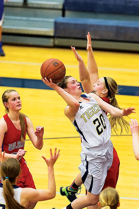<p>Timberlakes Allison Kirby goes above Filer defenders to put up a third quarter score.</p>