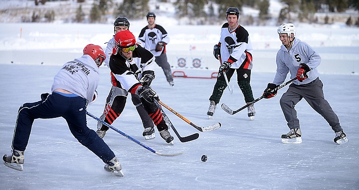 &lt;p&gt;Members of the Punishers and Four Men and a Neil scramble Friday morning for possession of the puck in the Just for Fun Under 35 division at the Montana Pond Hockey Classic at Foy&#146;s Lake. The Montana Pond Hockey Classic continues today and Sunday on Foy&#146;s Lake southwest of Kalispell. Spectators are welcome (parking costs $5). Competition goes from 8 a.m. to 4:30 p.m. today. On Sunday, playoff games will be held from 8 a.m. to 12:45 p.m. with championship games starting at 1:30 p.m. Tonight, Hockey Night in Montana starts at 6 p.m. at the Hilton Garden Inn in Kalispell. The event features food, drinks, raffles, a silent auction and skill competitions and a chance to have your picture taken with the Stanley Cup.&lt;/p&gt;&lt;p&gt;Tickets for Hockey Night are $20 for adults or $10 for children. The event is a fundraiser for the Flathead Valley Hockey Association.&lt;/p&gt;&lt;p&gt;For more information, go to www.pondhockeyclassic.com/montana.&lt;/p&gt;&lt;p&gt;&lt;/p&gt;