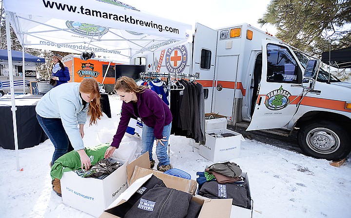 &lt;p&gt;Shelby Guthrie, left, and Megan Jackson sort shirts and items for sale from the Tamarack Brewing Company at the start of the Montana Pond Hockey Classic at Foy's Lake on Friday, February 21. (Brenda Ahearn/Daily Inter Lake)&lt;/p&gt;