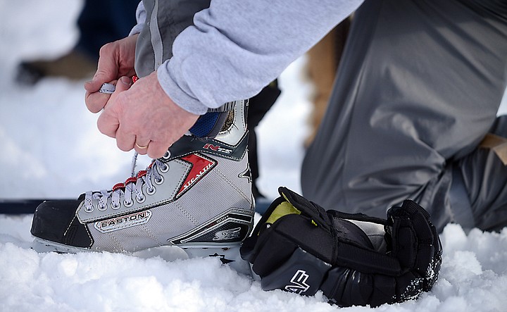 &lt;p&gt;A skater laces up before stepping out on to the ice on Friday, February 21, at the Montana Pond Hockey Classic at Foy's Lake. (Brenda Ahearn/Daily Inter Lake)&lt;/p&gt;