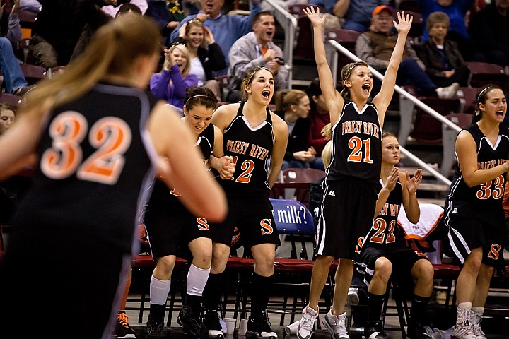&lt;p&gt;Priest River High's Courtney Oscarson celebrates (21) with team mates as the Spartans score in the final minutes of Saturday's 3A state basketball championship game at the Idaho Center in Nampa. Priest River won the 3A state title over Kellogg High School 45-33.&lt;/p&gt;