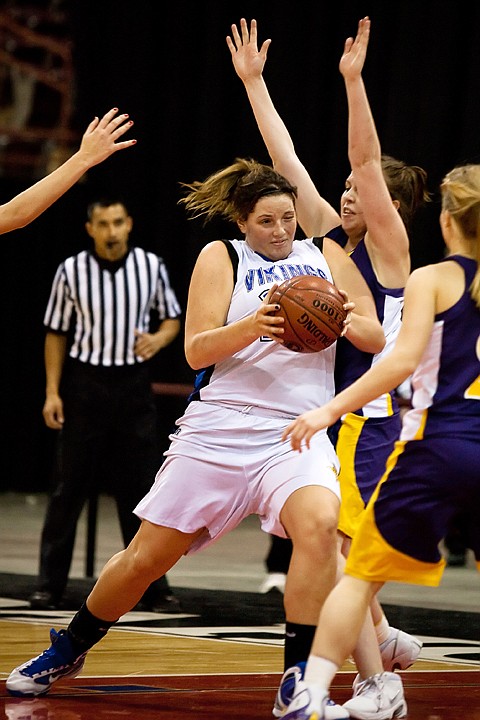 &lt;p&gt;Coeur d'Alene High's Carli Rosenthal shoulders a Lewiston defender on her way to the basket during the second half.&lt;/p&gt;