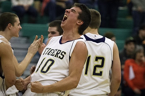 &lt;p&gt;Timberlake High School's Sam McNamara celebrates after winning the 3A District 1 boys basketball tournament against Priest River High Wednesday in Rathdrum.&lt;/p&gt;