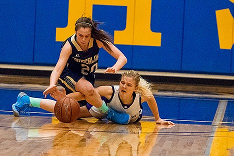 &lt;p&gt;Timberlake&#146;s Allison Kirby (20) battles Snake River High School&#146;s Ivy Goff for a loose ball in the first quarter in their 3A girls basketball tournament opener Thursday at Middleton High.&lt;/p&gt;