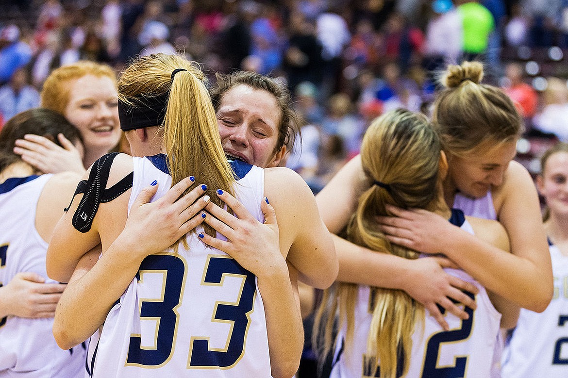 &lt;p&gt;SHAWN GUST/Press Allison Kirby hugs Keelie Lawler (33) after winning the state 3A girls basketball title.&lt;/p&gt;