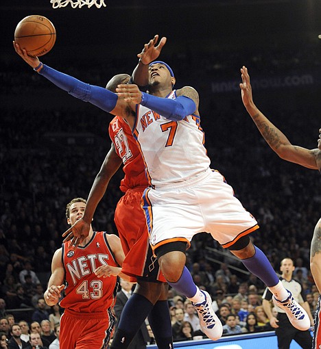 &lt;p&gt;New York Knicks' Carmelo Anthony (7) puts up a shot as he is guarded by New Jersey Nets' Johan Petro, of France, during the second quarter of an NBA basketball game, Monday, Feb. 20, 2012, at Madison Square Garden in New York. (AP Photo/Bill Kostroun)&lt;/p&gt;