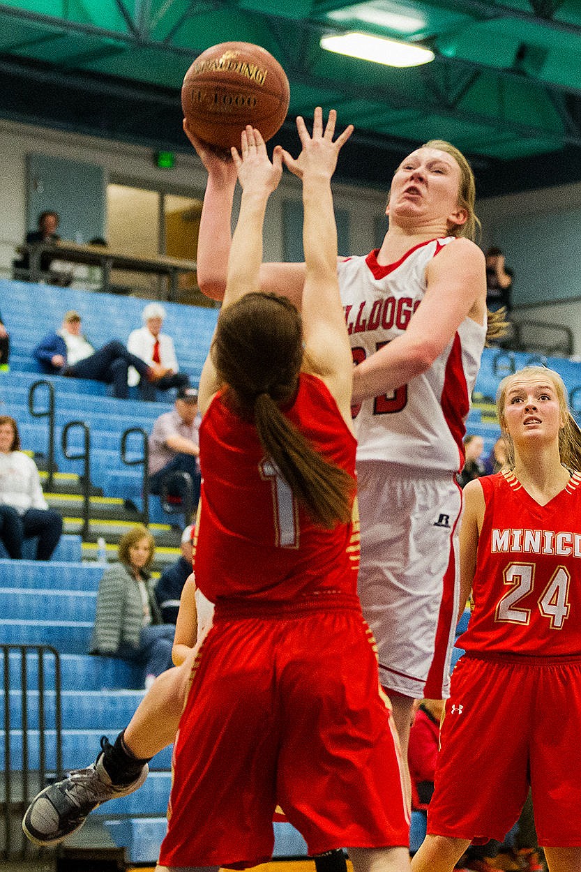 &lt;p&gt;SHAWN GUST/Press Sandpoint&#146;s Grace Kirscher puts up a shot above Minico defender Marcie Merrill in the second half.&lt;/p&gt;