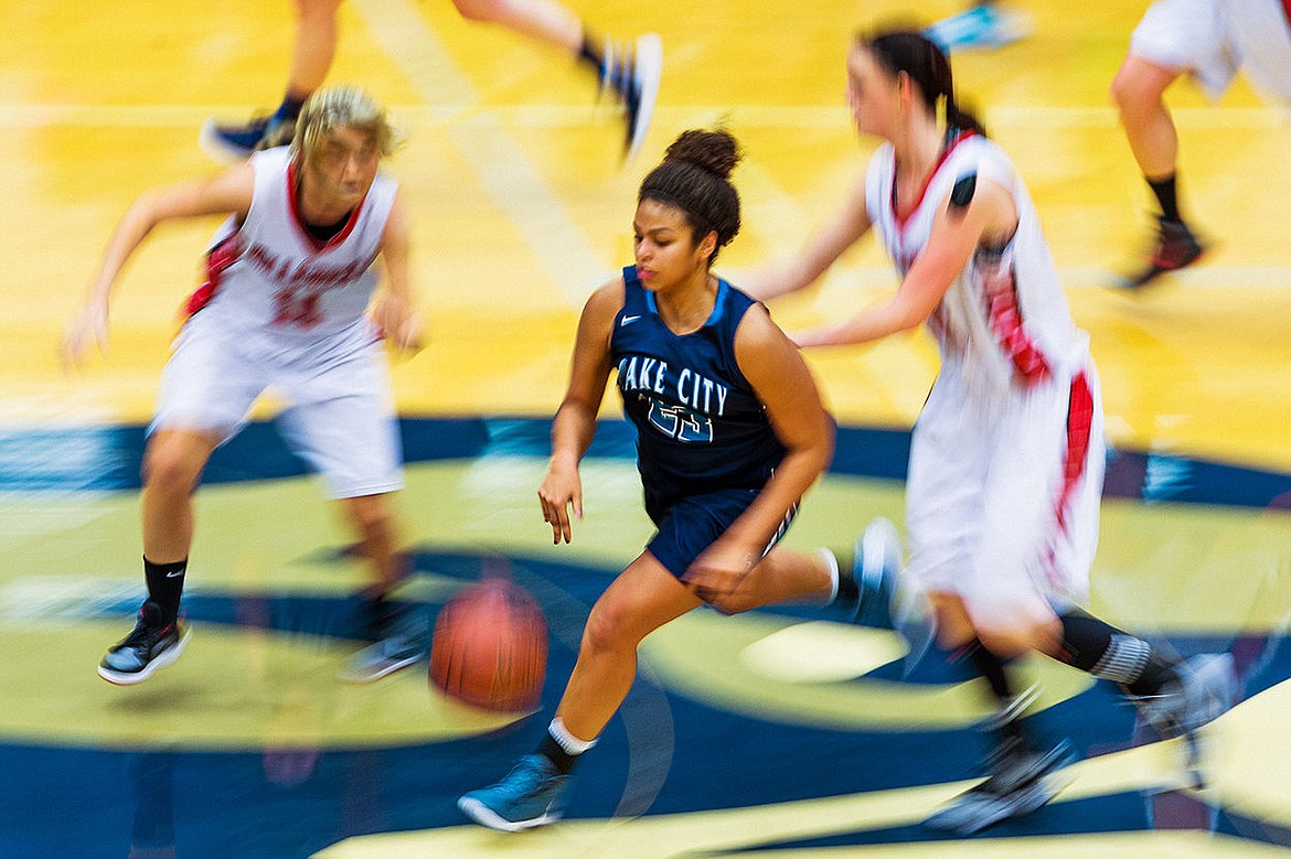 &lt;p&gt;SHAWN GUST/Press Whitney Meier speeds up the court past Hillcrest defenders during the second half of the consolation championship game.&lt;/p&gt;