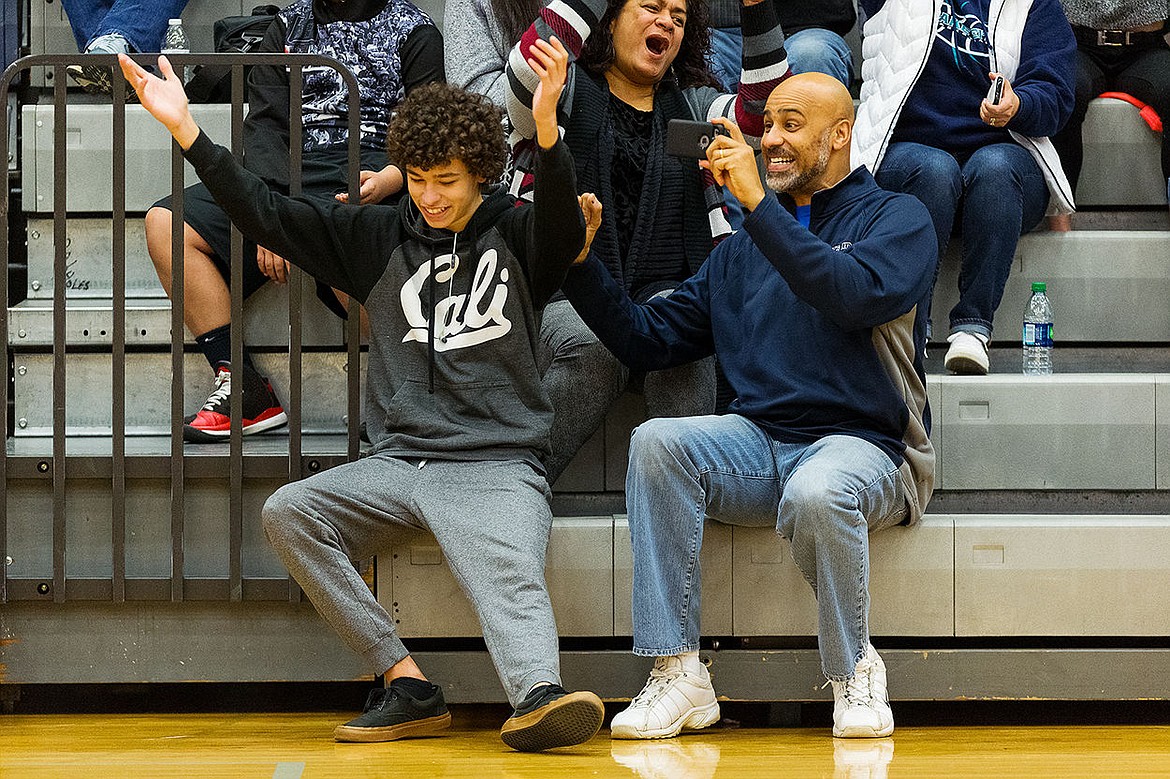 &lt;p&gt;SHAWN GUST/Press Brian Meier, right, and son Devon, 15, cheer after a 3-point shot by Whitney Meier during the fourth quarter.&lt;/p&gt;