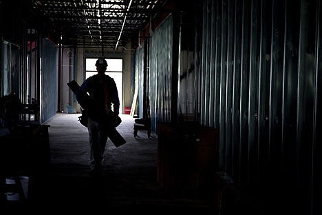 &lt;p&gt;Chuck Helton carries an arm full of metal studs to a room for installation at the new Winton Elementary Site on Friday in Coeur d'Alene. Construction is on schedule for the new school to be finished by Aug. 1.&lt;/p&gt;